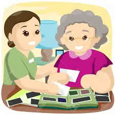 Senior and Caregiver Reviewing pictures